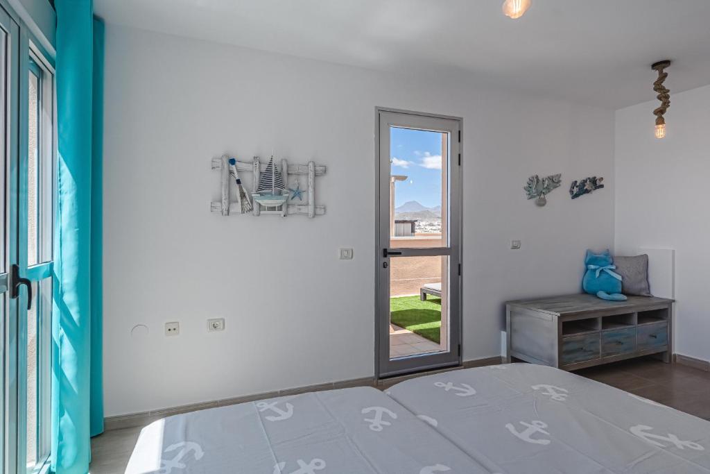 Postel nebo postele na pokoji v ubytování Pambnb - Sea Breeze Duplex Arenal