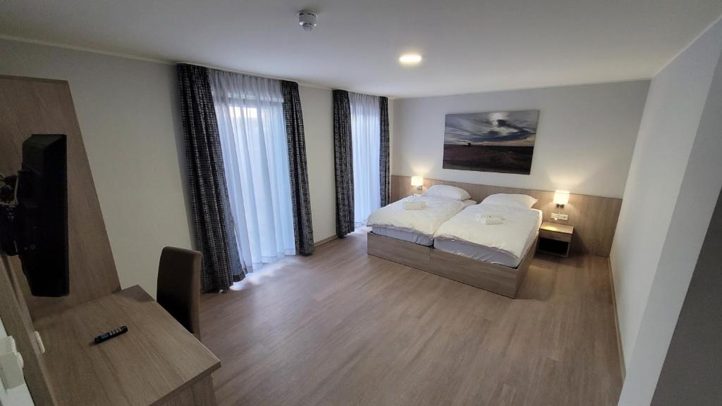 Katil atau katil-katil dalam bilik di Landgasthof Kelzenberg