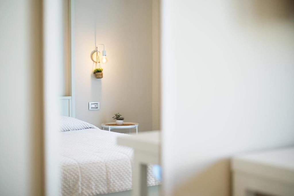 Łóżko lub łóżka w pokoju w obiekcie Enjoy Your Stay - Guest House - Olbia