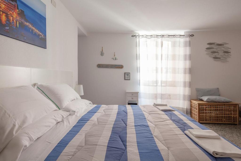 Postel nebo postele na pokoji v ubytování Ludovica Flat