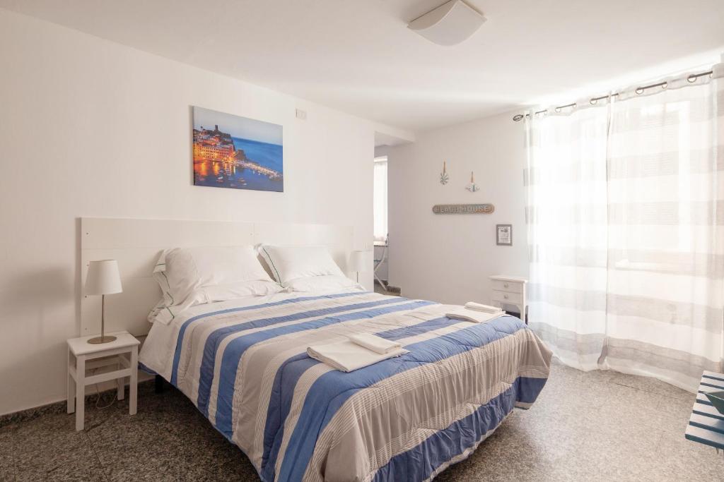 Postel nebo postele na pokoji v ubytování Ludovica Flat