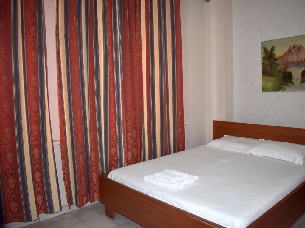 Postel nebo postele na pokoji v ubytování Hotel Central