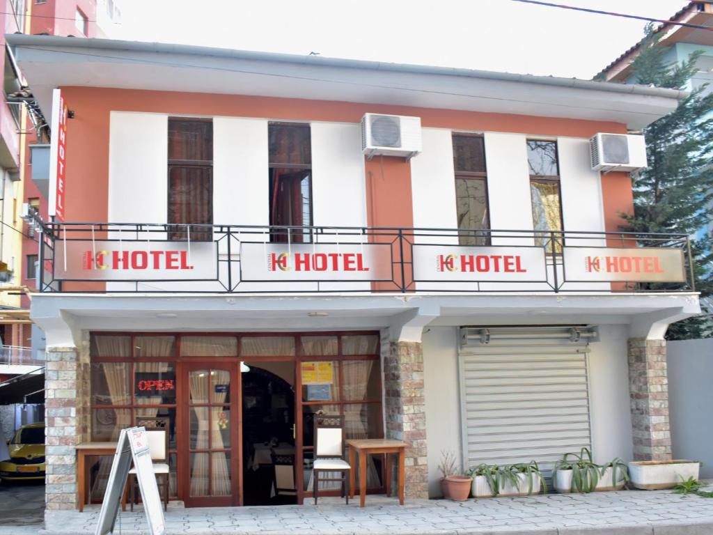 a restaurant with a large window on the side of the building at Hotel Central in Tirana
