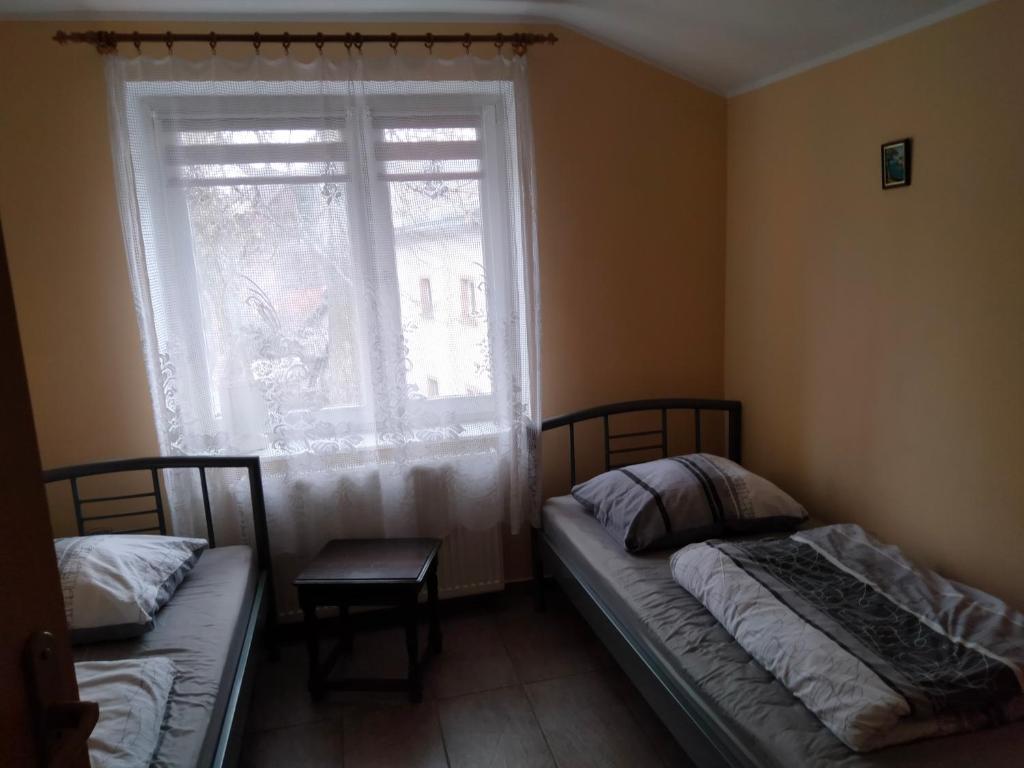 Posteľ alebo postele v izbe v ubytovaní Strumyk