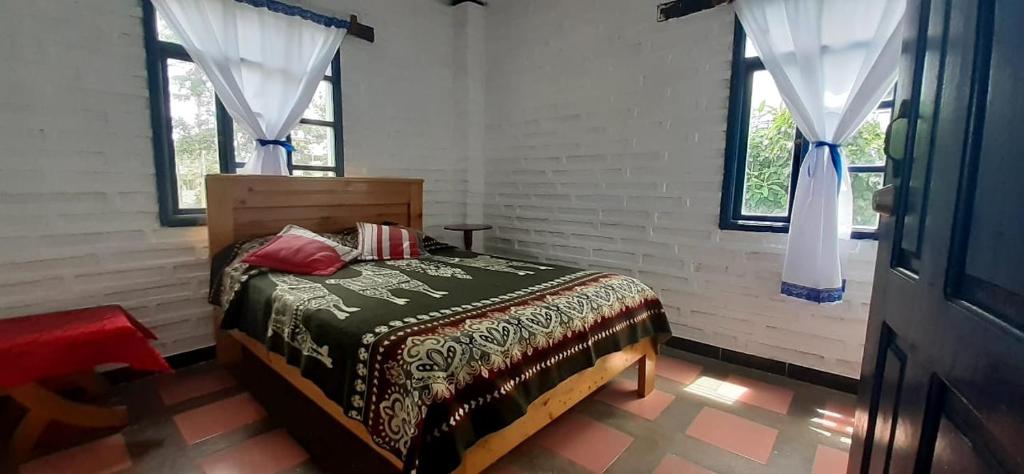 Postel nebo postele na pokoji v ubytování Hostería Chíguac