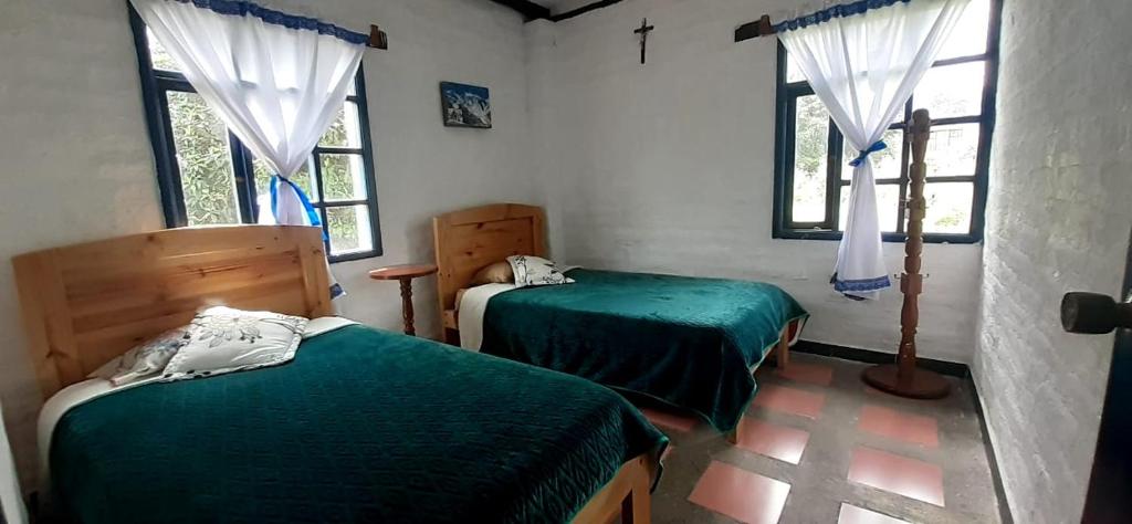 Postel nebo postele na pokoji v ubytování Hostería Chíguac