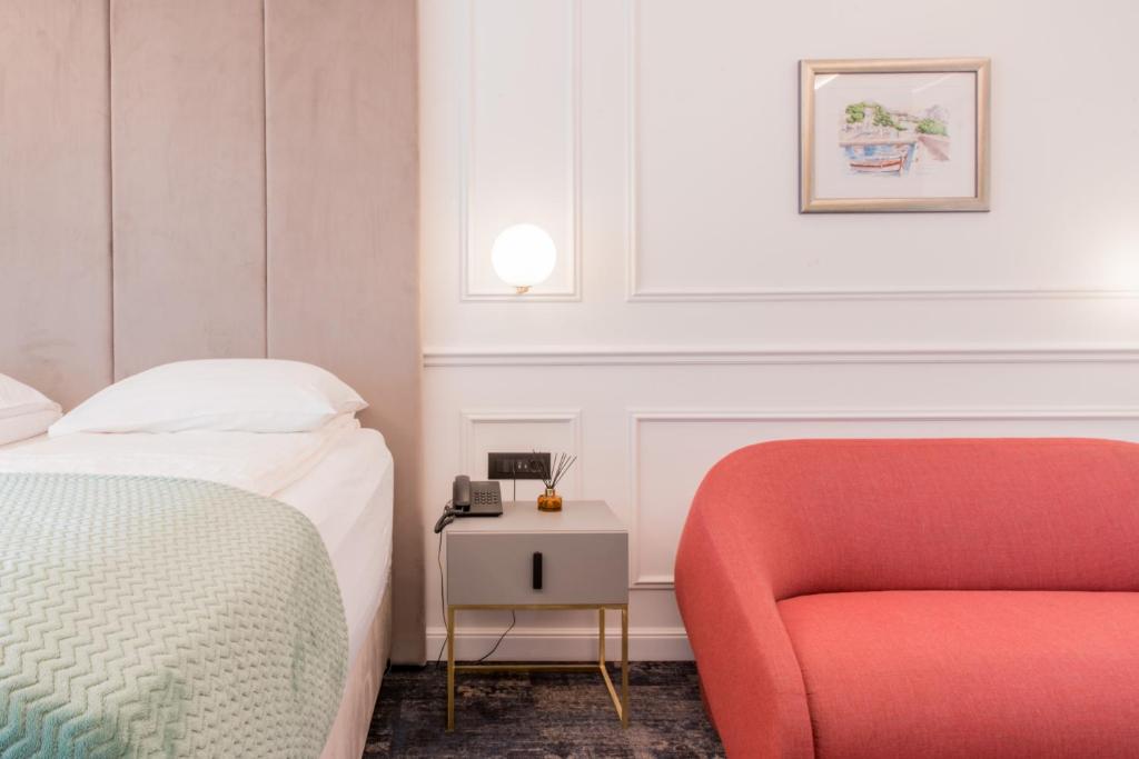 Postel nebo postele na pokoji v ubytování Hotel Krilo