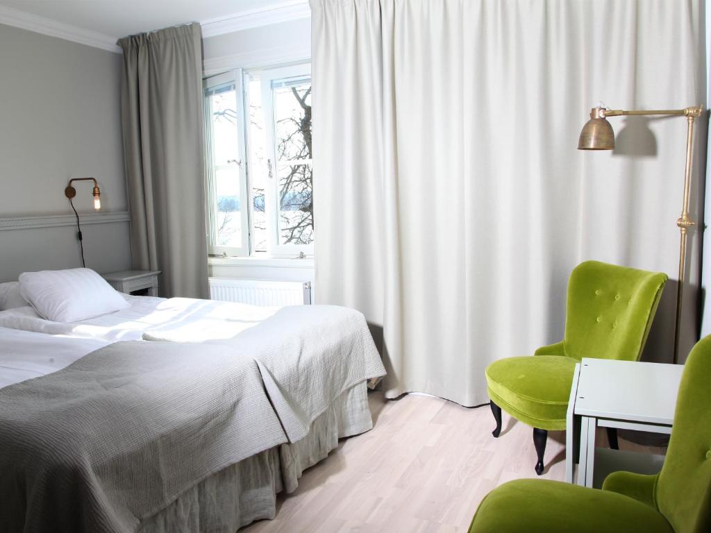 Postel nebo postele na pokoji v ubytování Södertuna Slott
