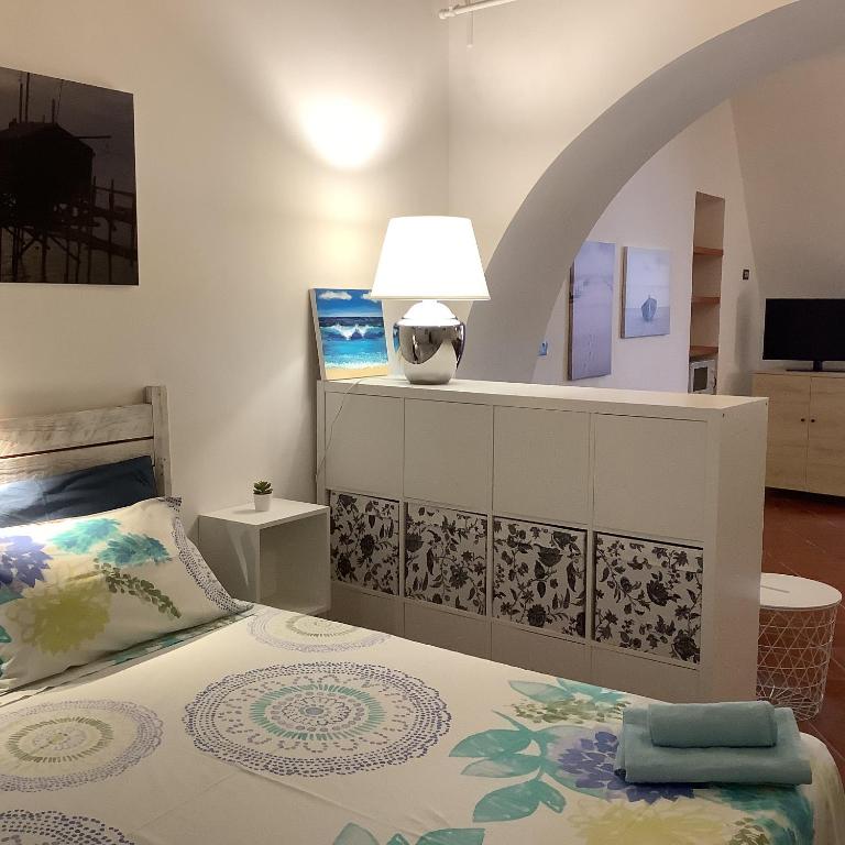 A bed or beds in a room at La Casetta nel Borgo