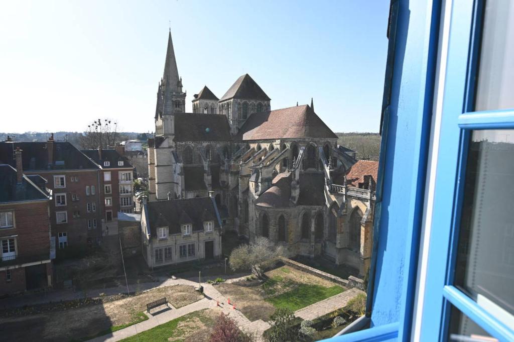 a view from a window of an old building at Villa Normande in Lisieux