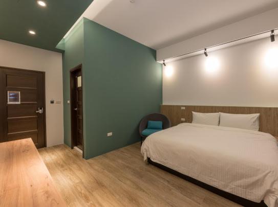 Postel nebo postele na pokoji v ubytování Yujing B&B 2