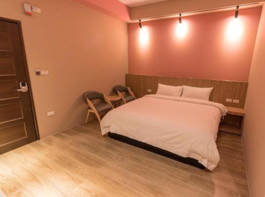 Postel nebo postele na pokoji v ubytování Yujing B&B 2