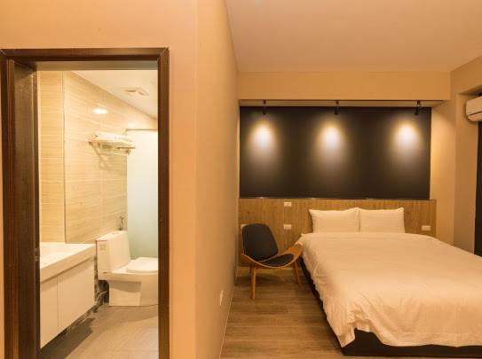 Postel nebo postele na pokoji v ubytování Yujing B&B 2