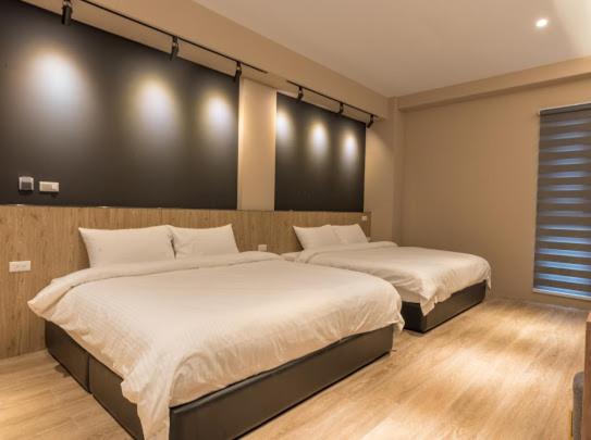 Postel nebo postele na pokoji v ubytování Yujing B&B 2