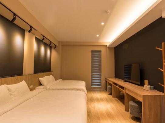 Postel nebo postele na pokoji v ubytování Yujing B&B 2