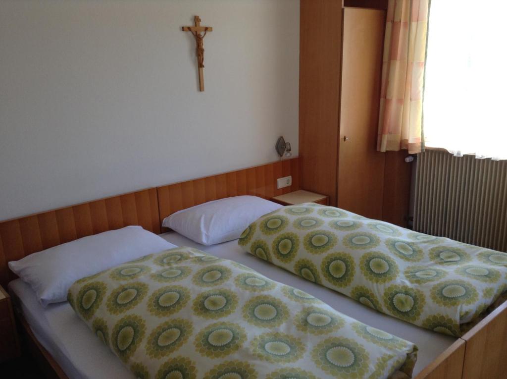 Postel nebo postele na pokoji v ubytování Garni Hofer