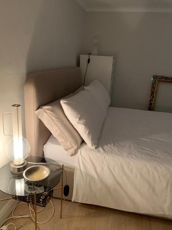 A bed or beds in a room at Appartamento Torino Centro