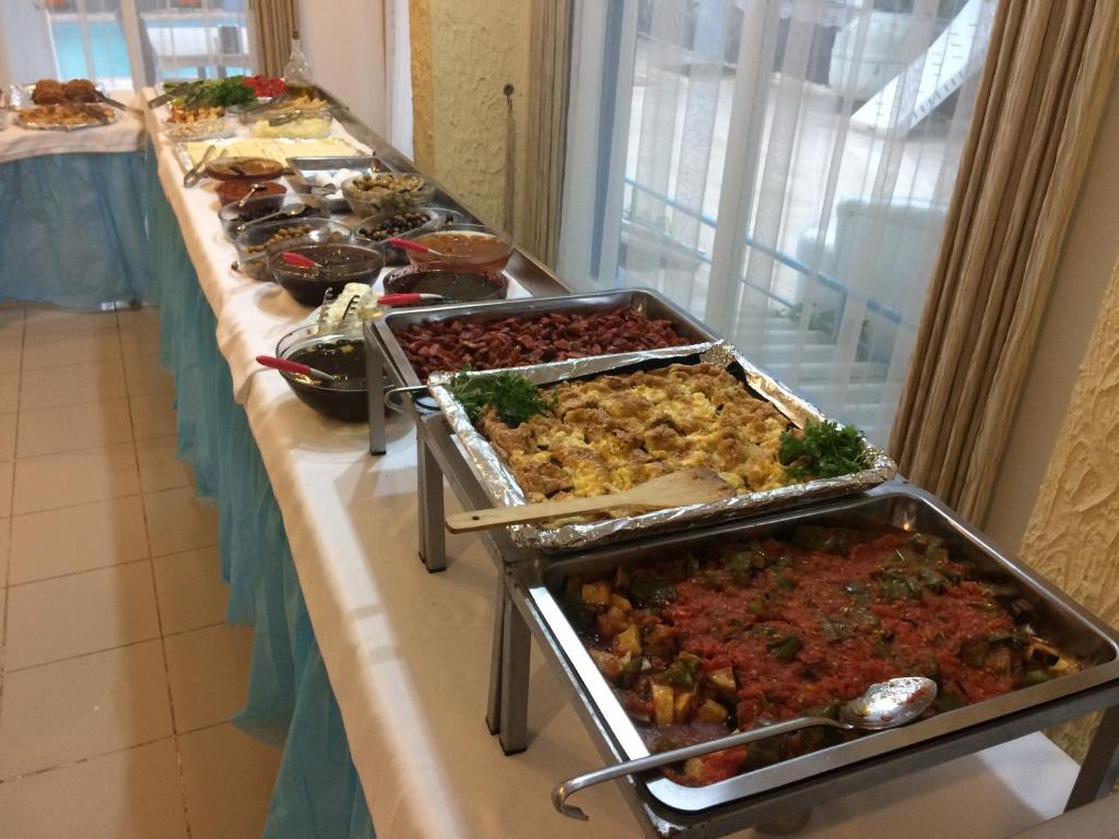 a buffet line with many different types of food at Marigold Otel in Çeşme