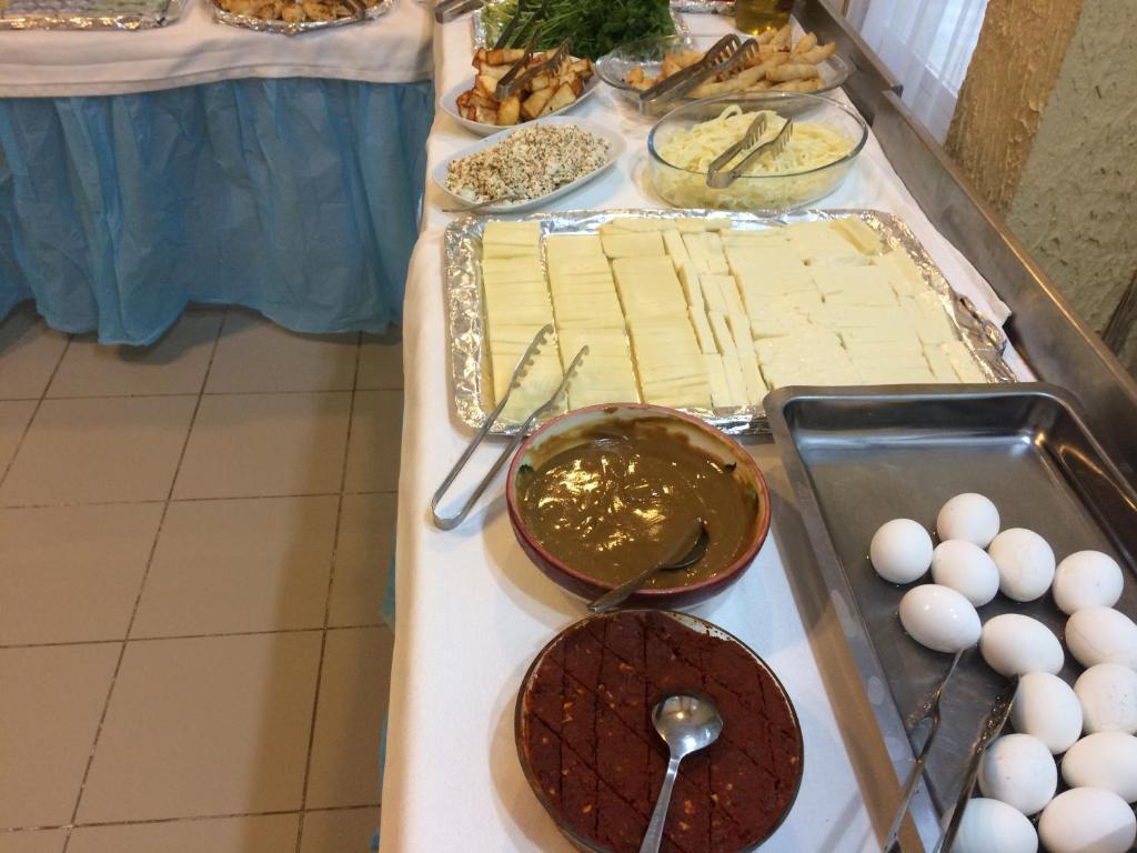 a buffet with chocolate and other food on a table at Marigold Otel in Çeşme