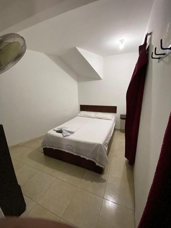 Postel nebo postele na pokoji v ubytování Hotel Policarpa