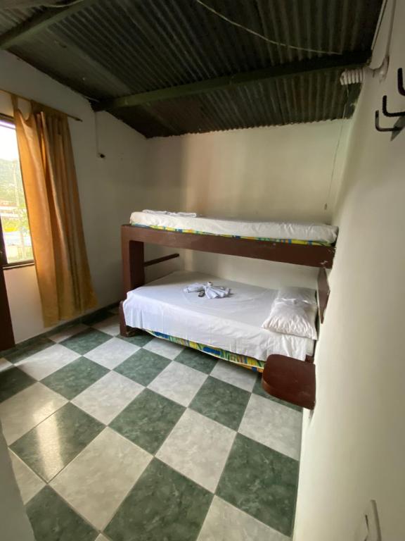 Postel nebo postele na pokoji v ubytování Hotel Policarpa