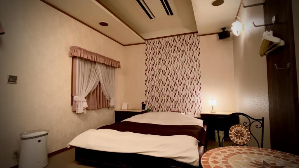 Postel nebo postele na pokoji v ubytování Hotel Sagano (Adult only)