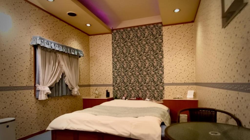 Postel nebo postele na pokoji v ubytování Hotel Sagano (Adult only)