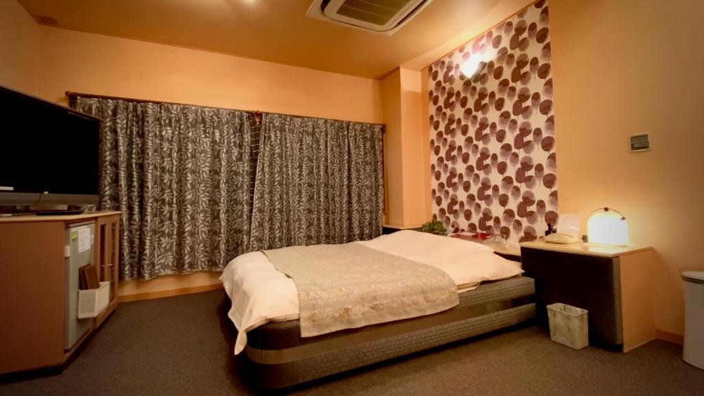 Postel nebo postele na pokoji v ubytování Hotel Sagano (Adult only)