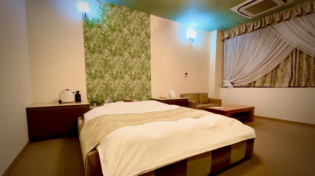Postel nebo postele na pokoji v ubytování Hotel Sagano (Adult only)