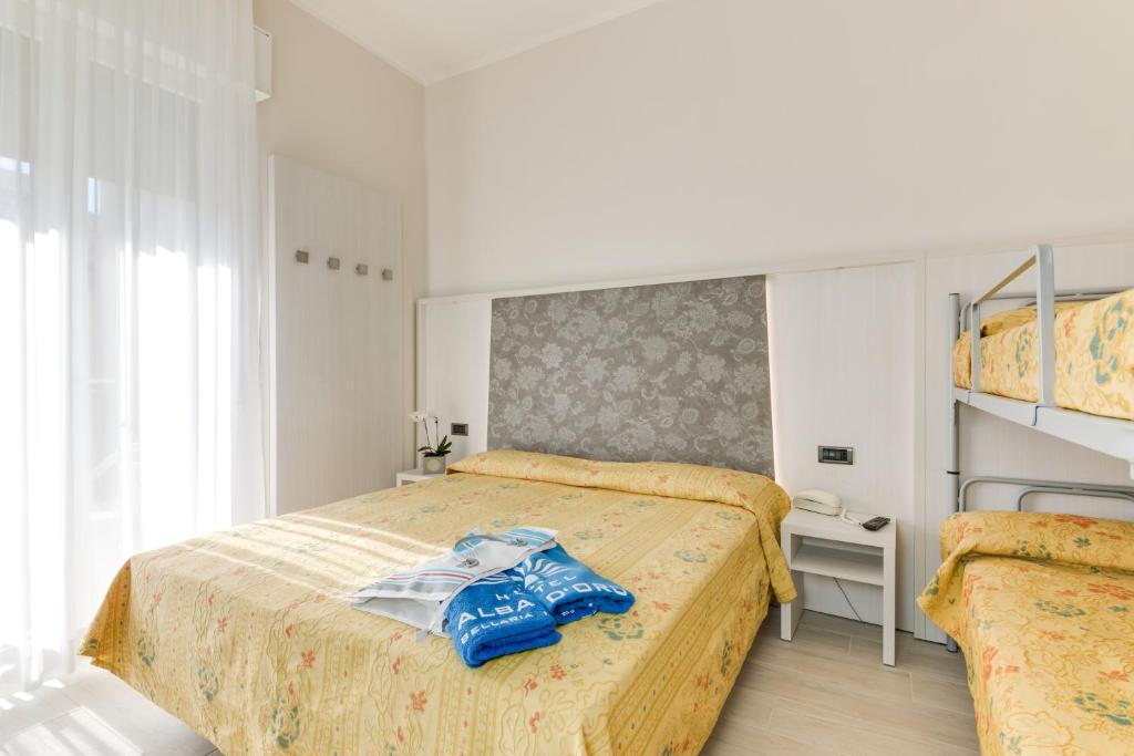 a bedroom with two beds and a bunk bed at Hotel Alba D'Oro in Bellaria-Igea Marina