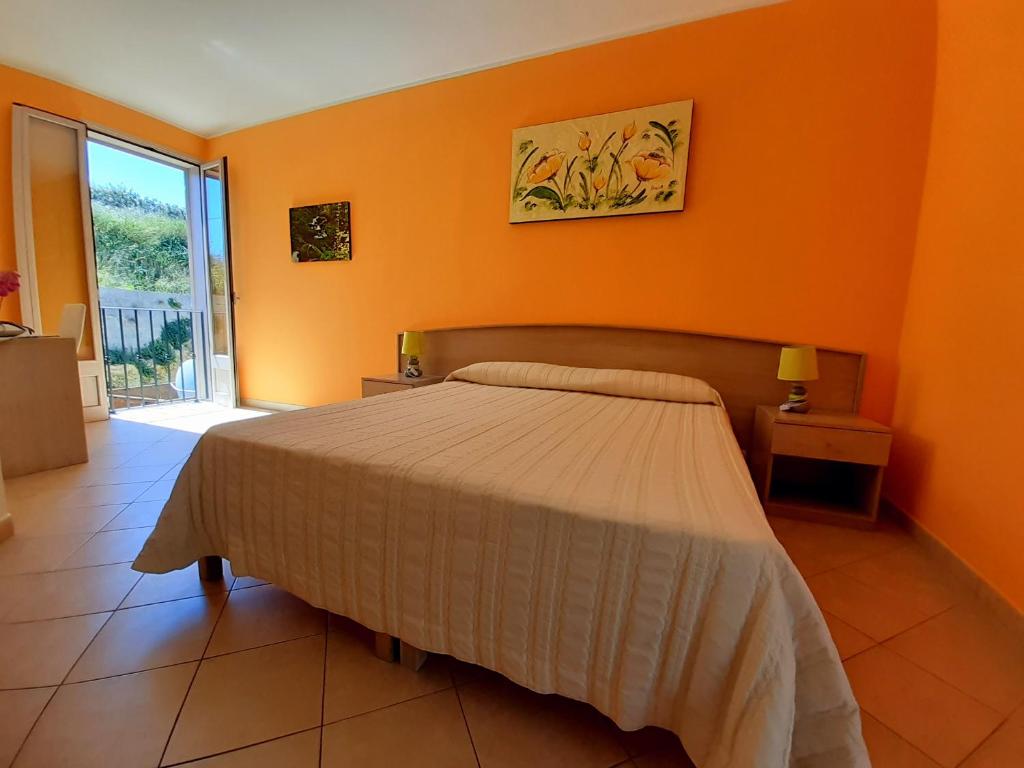 Postel nebo postele na pokoji v ubytování B&B Borgo Minerva