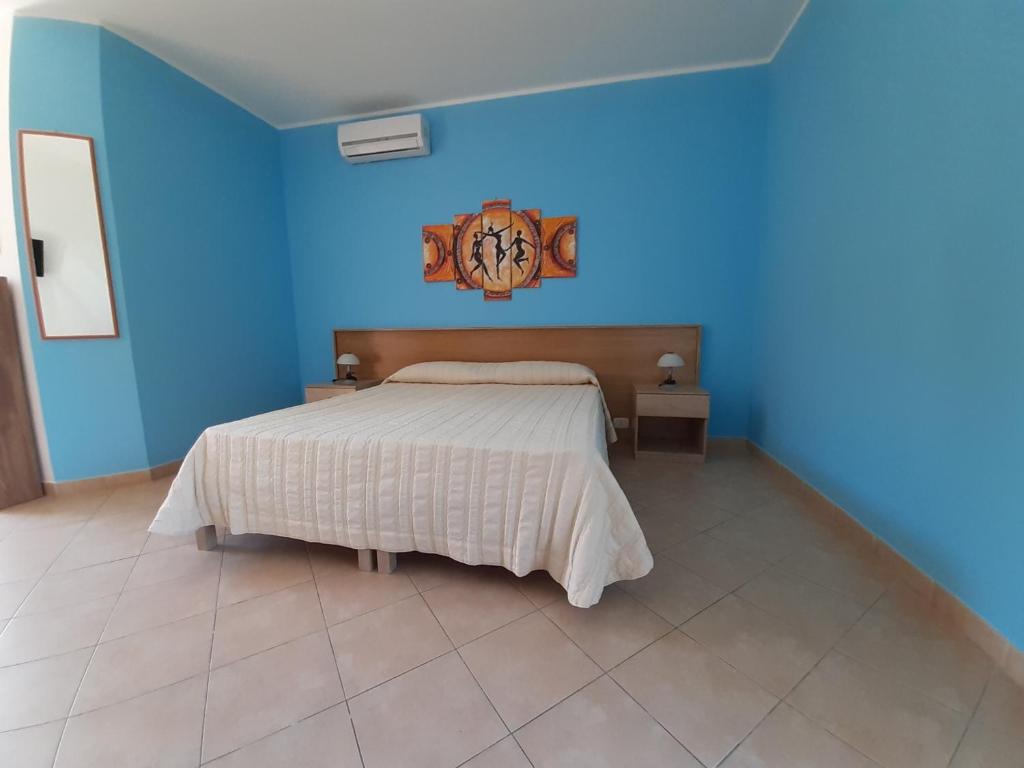 Postel nebo postele na pokoji v ubytování B&B Borgo Minerva