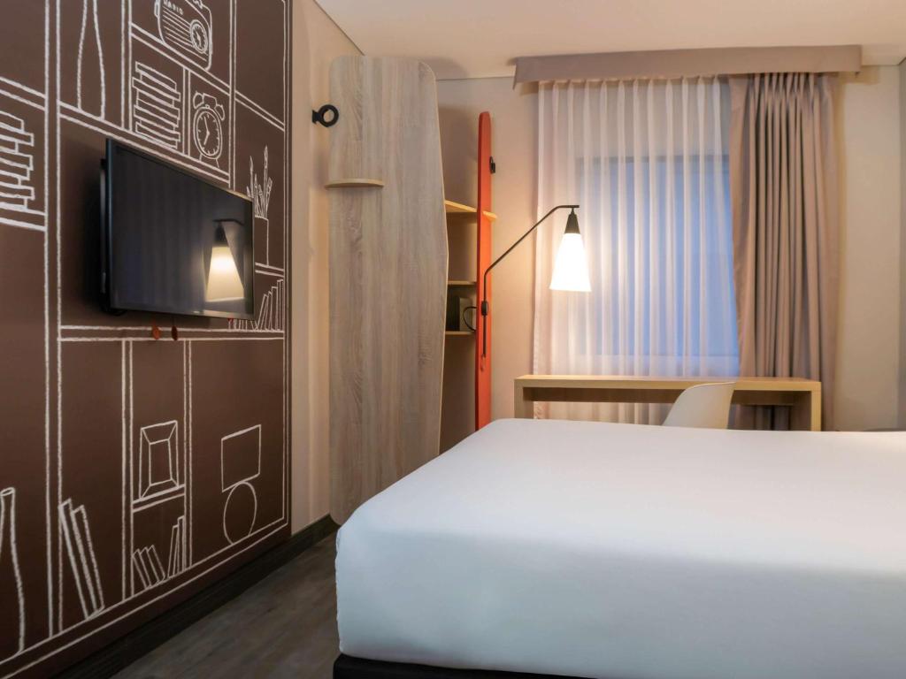 Postel nebo postele na pokoji v ubytování ibis Chia
