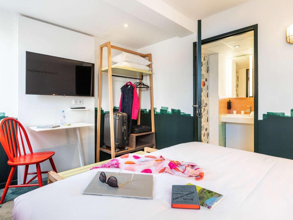 Postel nebo postele na pokoji v ubytování ibis Styles Thonon-les-Bains