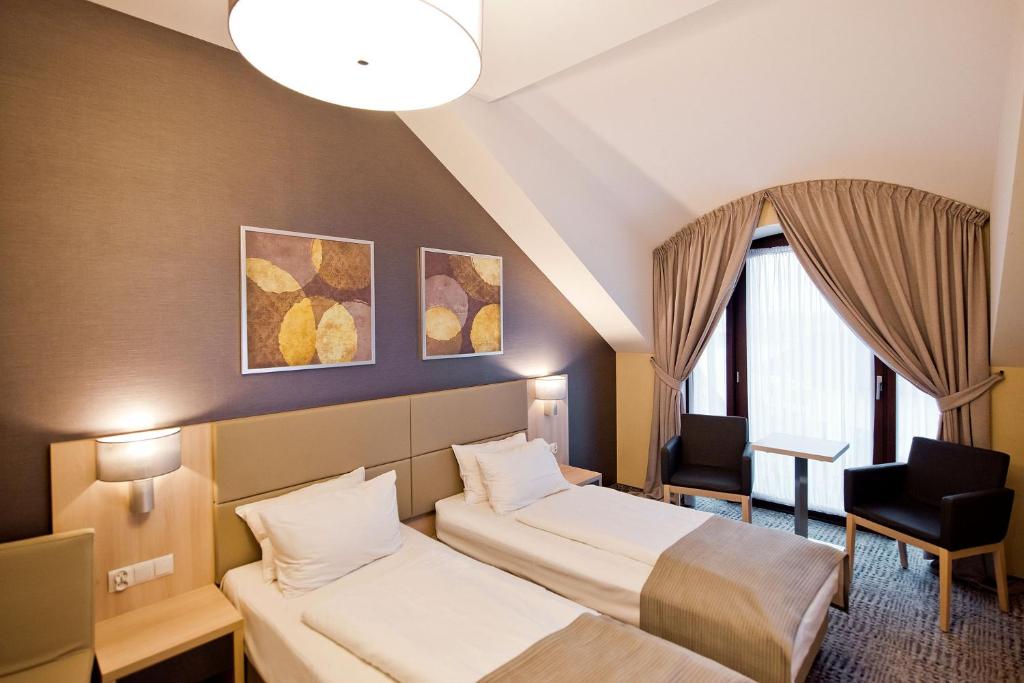 Postel nebo postele na pokoji v ubytování Hotel Molo Resort