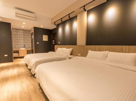 Postel nebo postele na pokoji v ubytování Yujing B&B 2