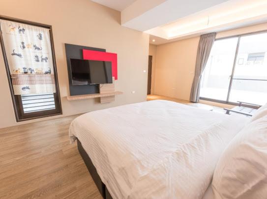 Postel nebo postele na pokoji v ubytování Yujing B&B 2