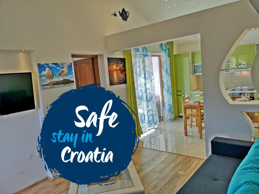 a sign that says sale stay in croatia in a living room at Apartments Bošković in Stari Grad