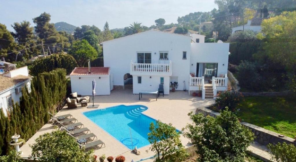 an aerial view of a house with a swimming pool at VILLA " VISTA JAVEA "- Home away from home in Jávea