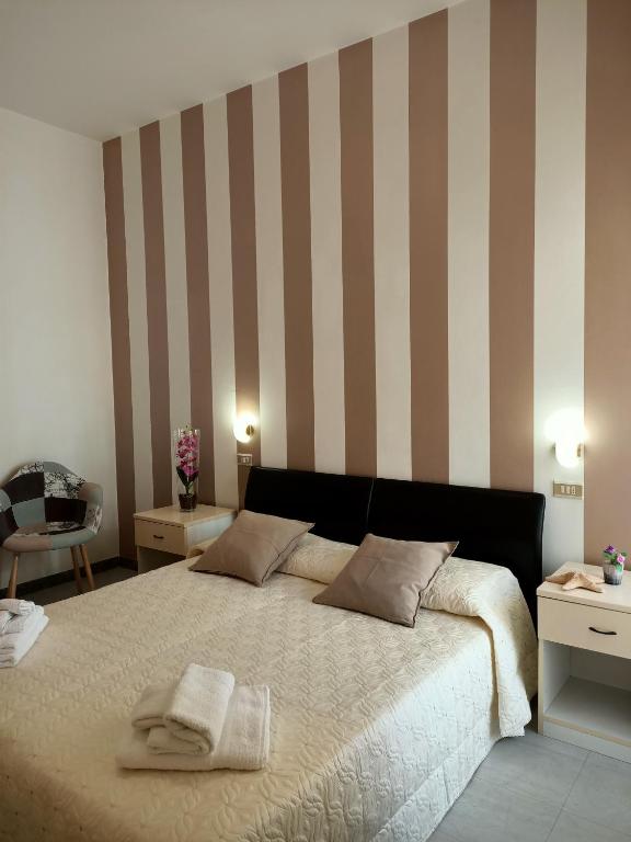 Postel nebo postele na pokoji v ubytování Hotel Cristoforo Colombo