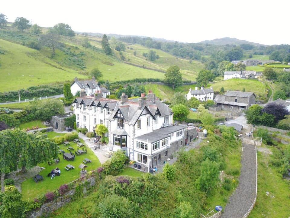 an aerial view of a large house on a hill at The Mortal Man Inn in Troutbeck