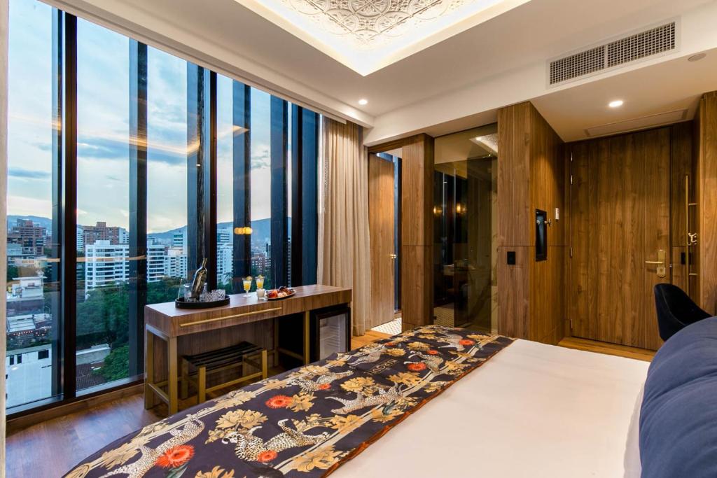 Postel nebo postele na pokoji v ubytování Hotel Marquee Medellín