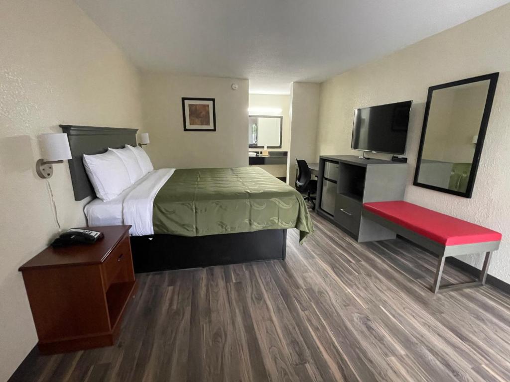 Postel nebo postele na pokoji v ubytování Dreamland Inn