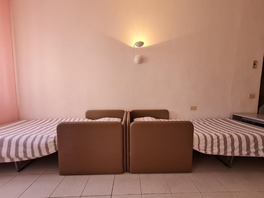 Postel nebo postele na pokoji v ubytování Hotel Da Graziano