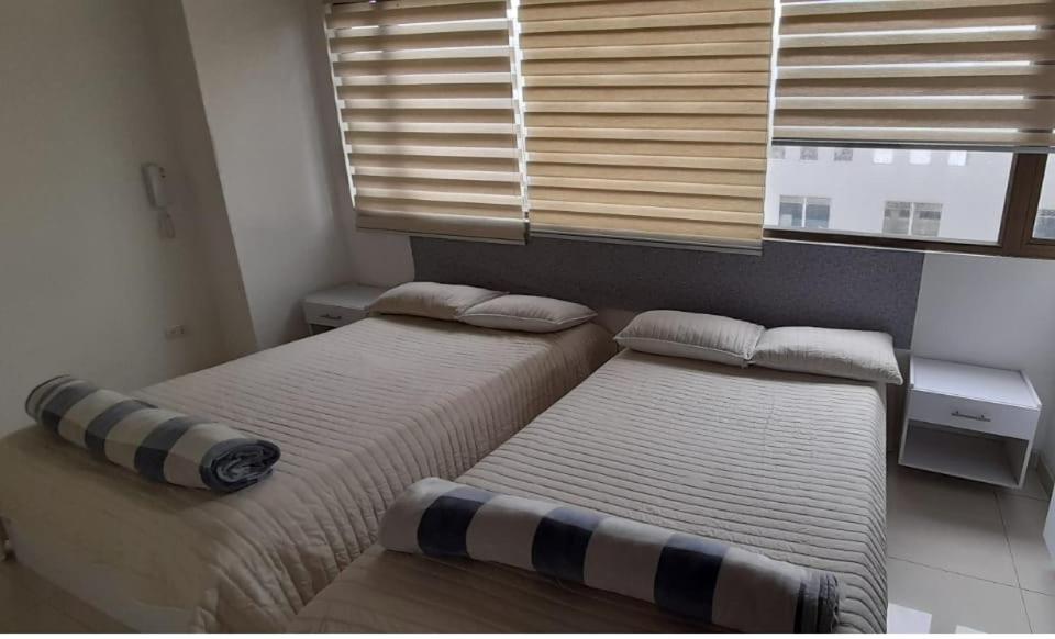 Postel nebo postele na pokoji v ubytování Hotel Las Colonias