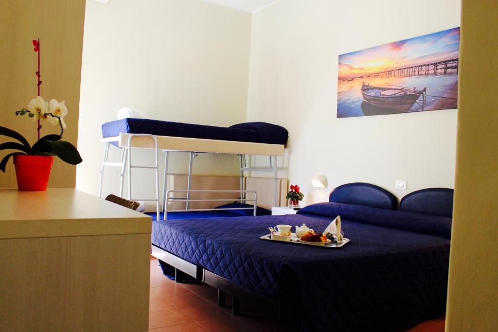 Postel nebo postele na pokoji v ubytování Hotel Fedora Rimini
