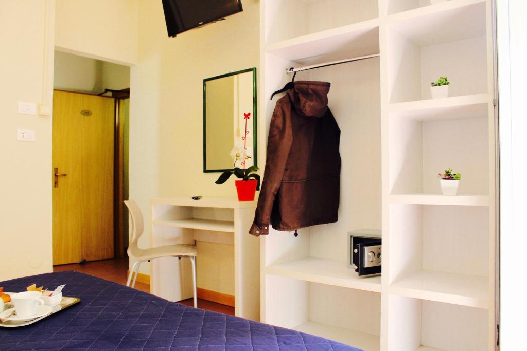 Postel nebo postele na pokoji v ubytování Hotel Fedora Rimini
