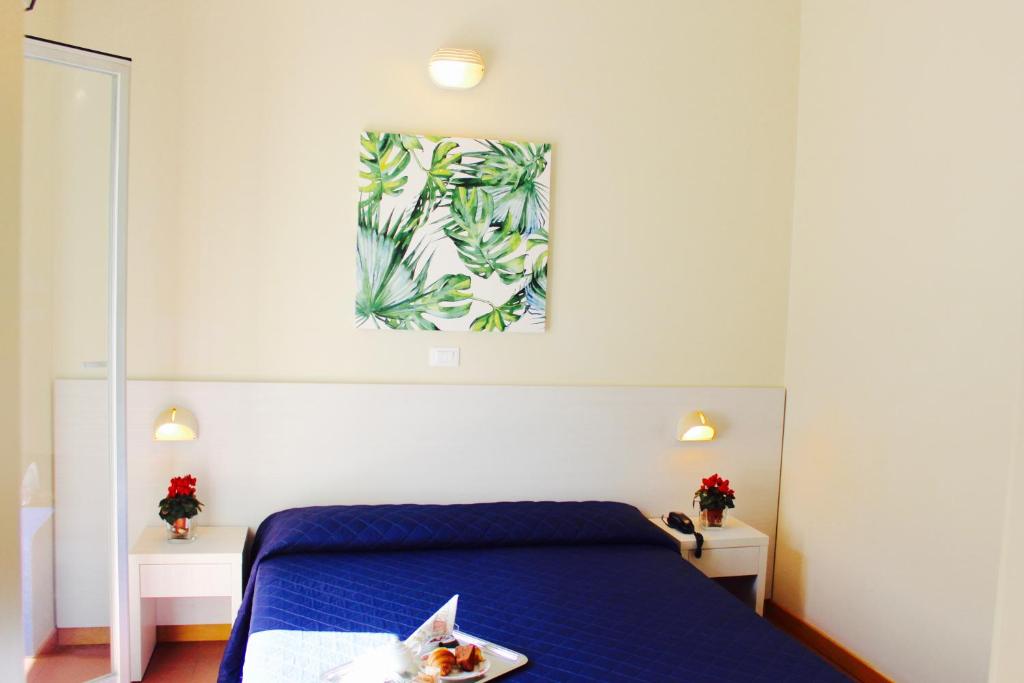 Postel nebo postele na pokoji v ubytování Hotel Fedora Rimini