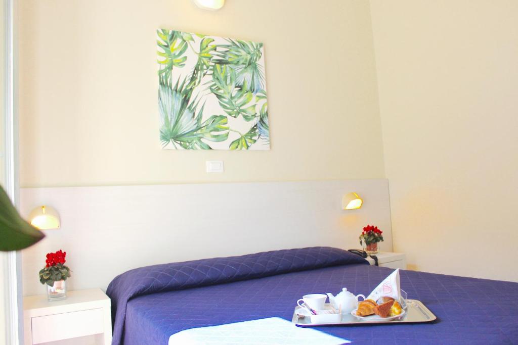 Postel nebo postele na pokoji v ubytování Hotel Fedora Rimini