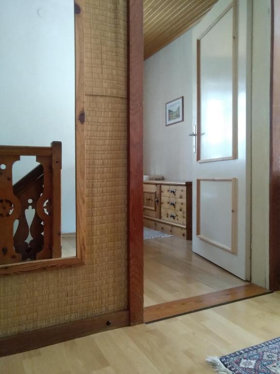 a room with a mirror and a sink in it at Appartements direkt am See in Grundlsee